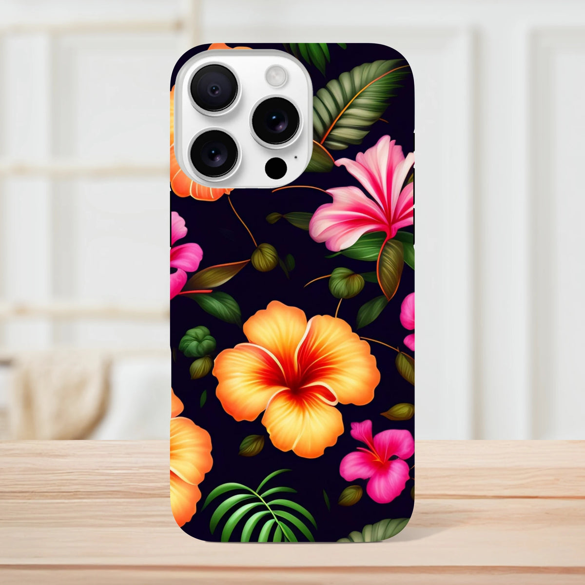 Tropical floral tough iPhone case featuring vibrant orange and pink hibiscus flowers with green leaves on a dark background.