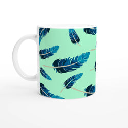 Blue Feather Mug with mint-green gradient and blue feather pattern, white handle.