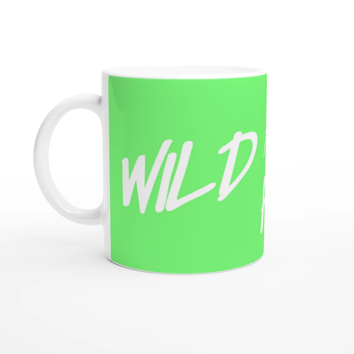 Lime-green mug with white handle displaying the Cute Wild And Free slogan in white script.