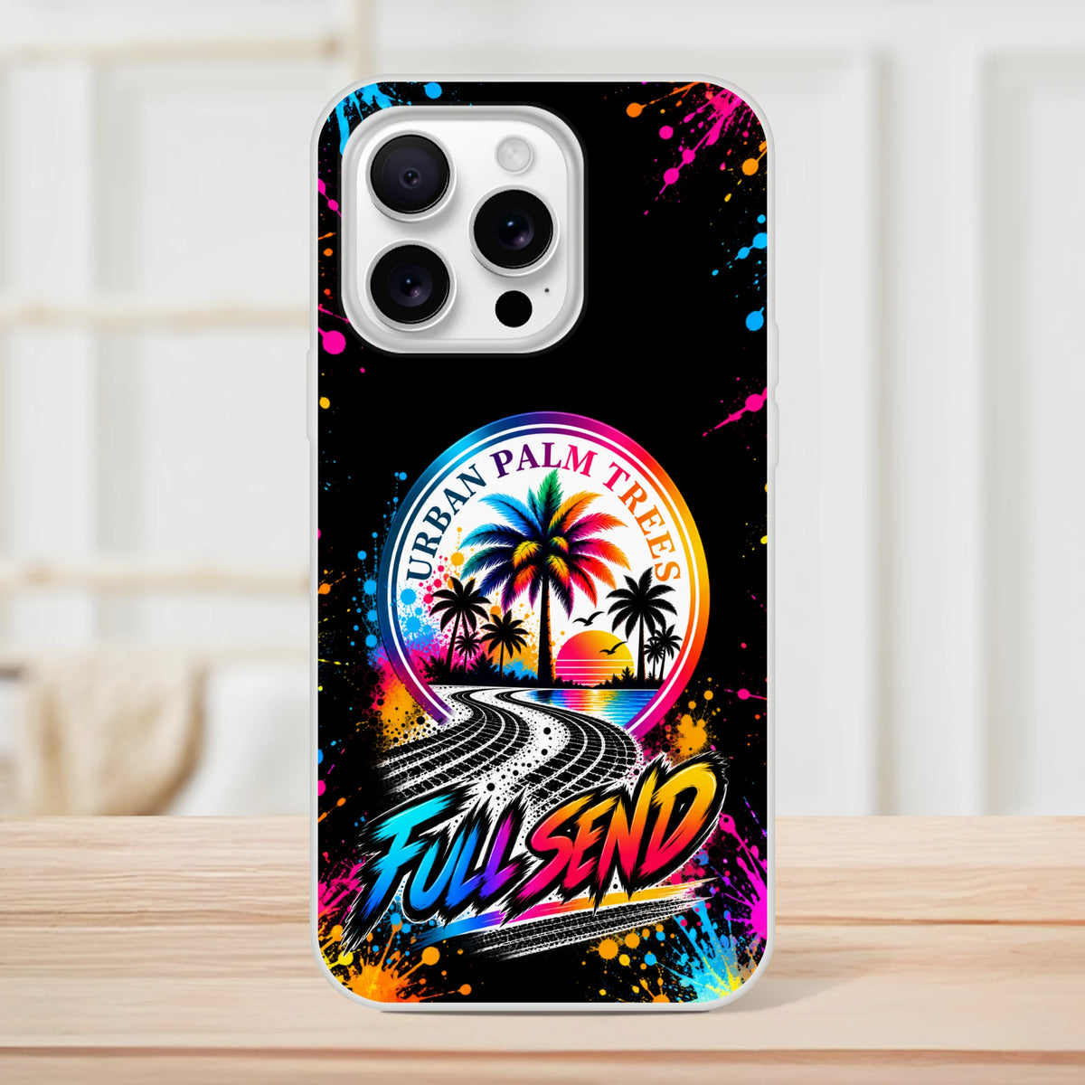 Full Send car culture iPhone case featuring Urban Palm Trees artwork, tire tracks, and colorful paint splatters on a black background.