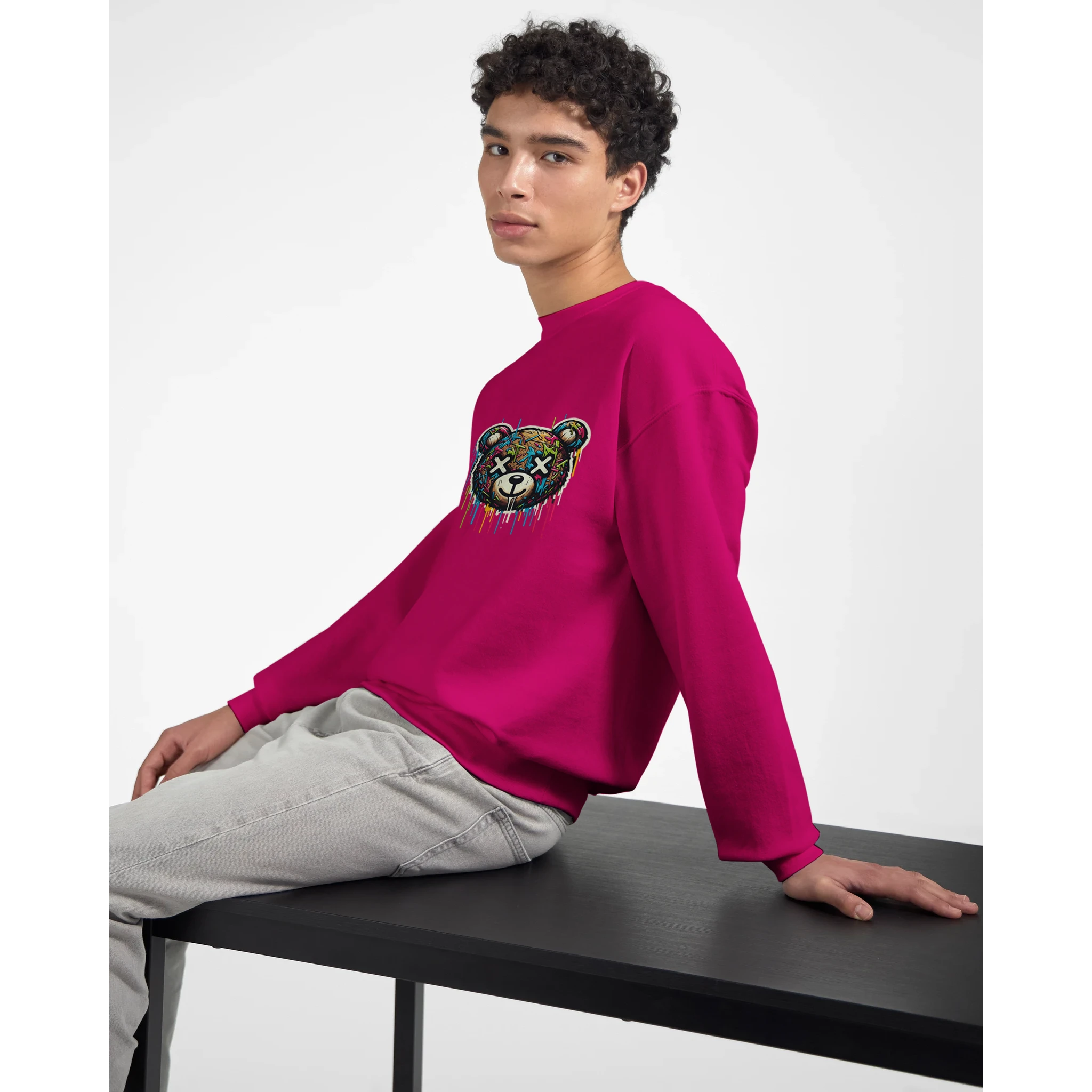Male model in pink Teddy Bear graphic men's sweatshirt with colorful bear artwork.