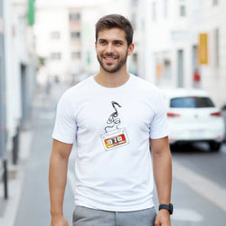 White men's t-shirt featuring a retro cassette tape graphic with unspooling tape and "80s Hits" text for nostalgic streetwear.