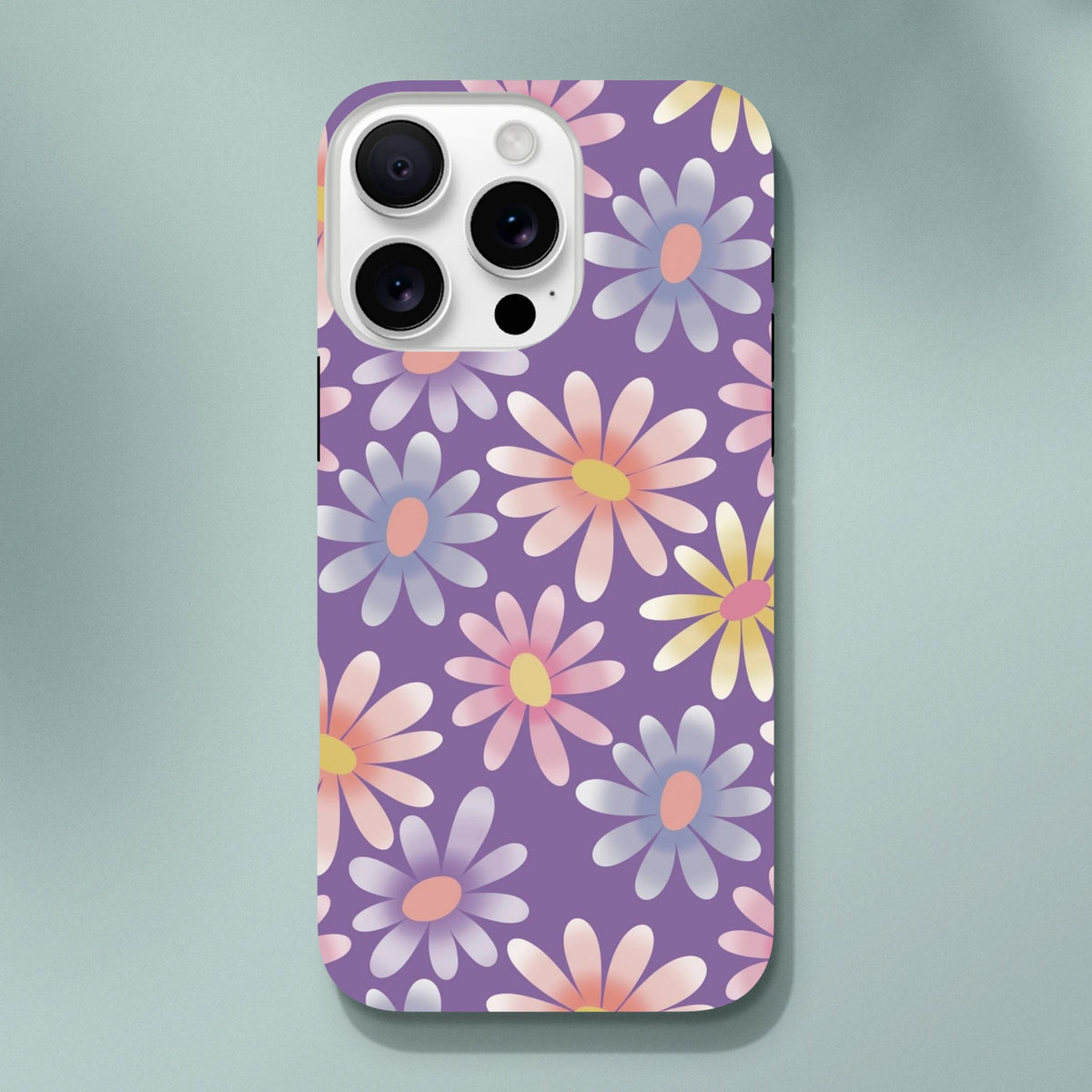 Purple retro floral iPhone case featuring a pastel daisy pattern and shock-absorbing TPU protection for models 13-16.
