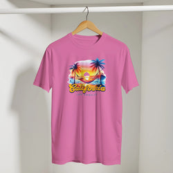 Pink retro California women's tee with tropical palm sunset graphic on a hanger
