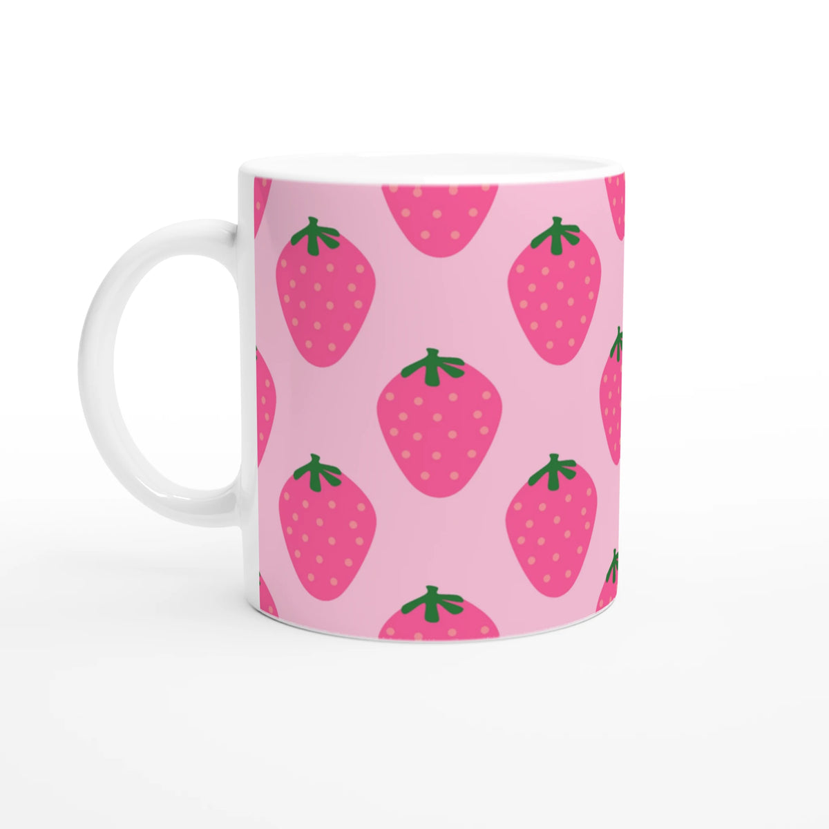 Cute pink strawberry mug with kawaii fruit design, green leaf tops and polka-dot pattern