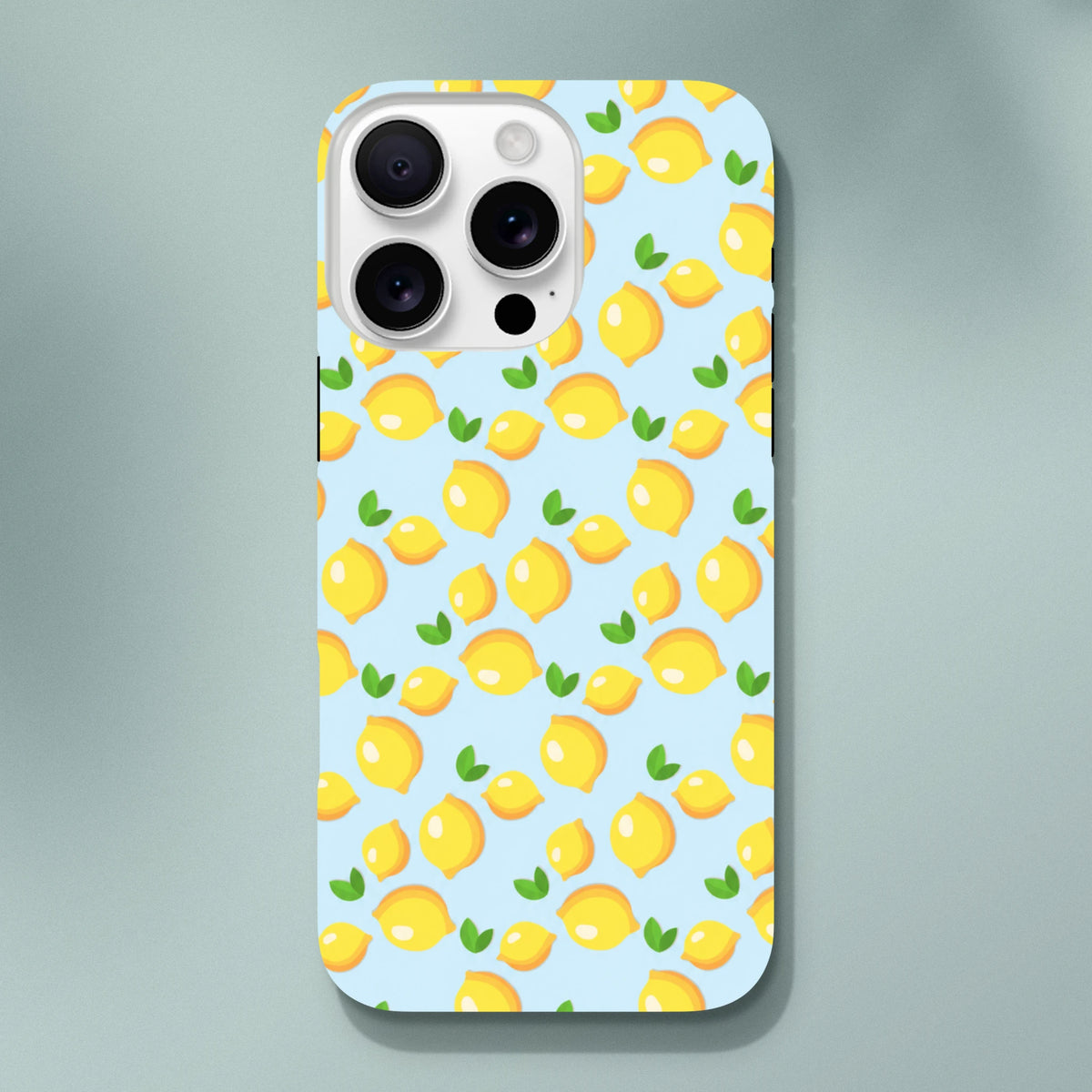 Cute lemon pattern iPhone case featuring fresh yellow fruit and green leaves on a light blue background.