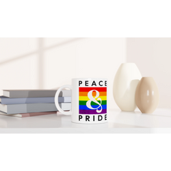 White ceramic Gay Pride mug with rainbow stripe and PRIDE text, perfect for daily coffee or tea.