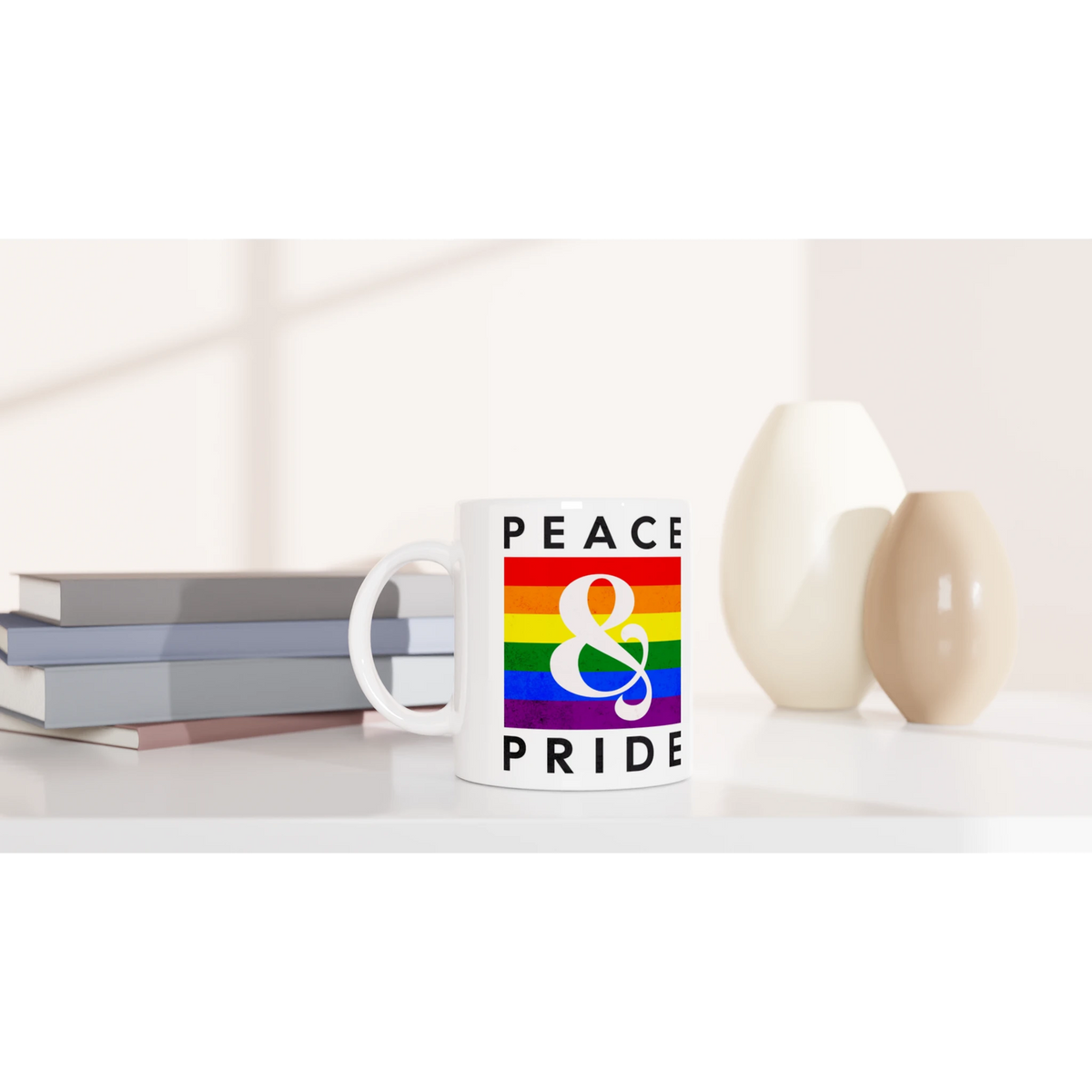 White ceramic Gay Pride mug with rainbow stripe and PRIDE text, perfect for daily coffee or tea.