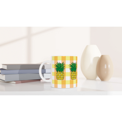 Cute pineapple gingham mug with yellow checks on white ceramic.