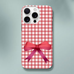 Red gingham iPhone case with a large pink coquette bow. Cute checkered phone cover for iPhone 13-16.