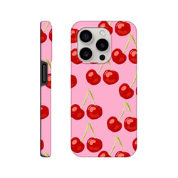 Pink iPhone case featuring a seamless wraparound print of cute red cherries with green stems on a vibrant pink background.