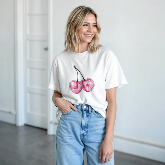 White cotton-blend Glitter Ball Cherries T-Shirt with pink cherry graphic on a casual-wear model.