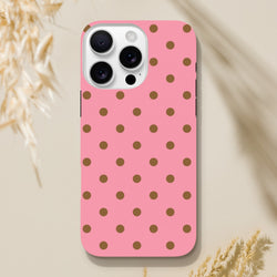 Pink and brown polka dot tough iPhone case with glossy finish, designed for shock absorption and durable daily protection.