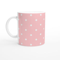 Retro pastel pink ceramic mug with white polka dots, featuring a white handle for cute coffee or tea.