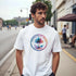 Man wearing retro palm tree T-shirt for men with a colorful circular palm graphic on an urban street.
