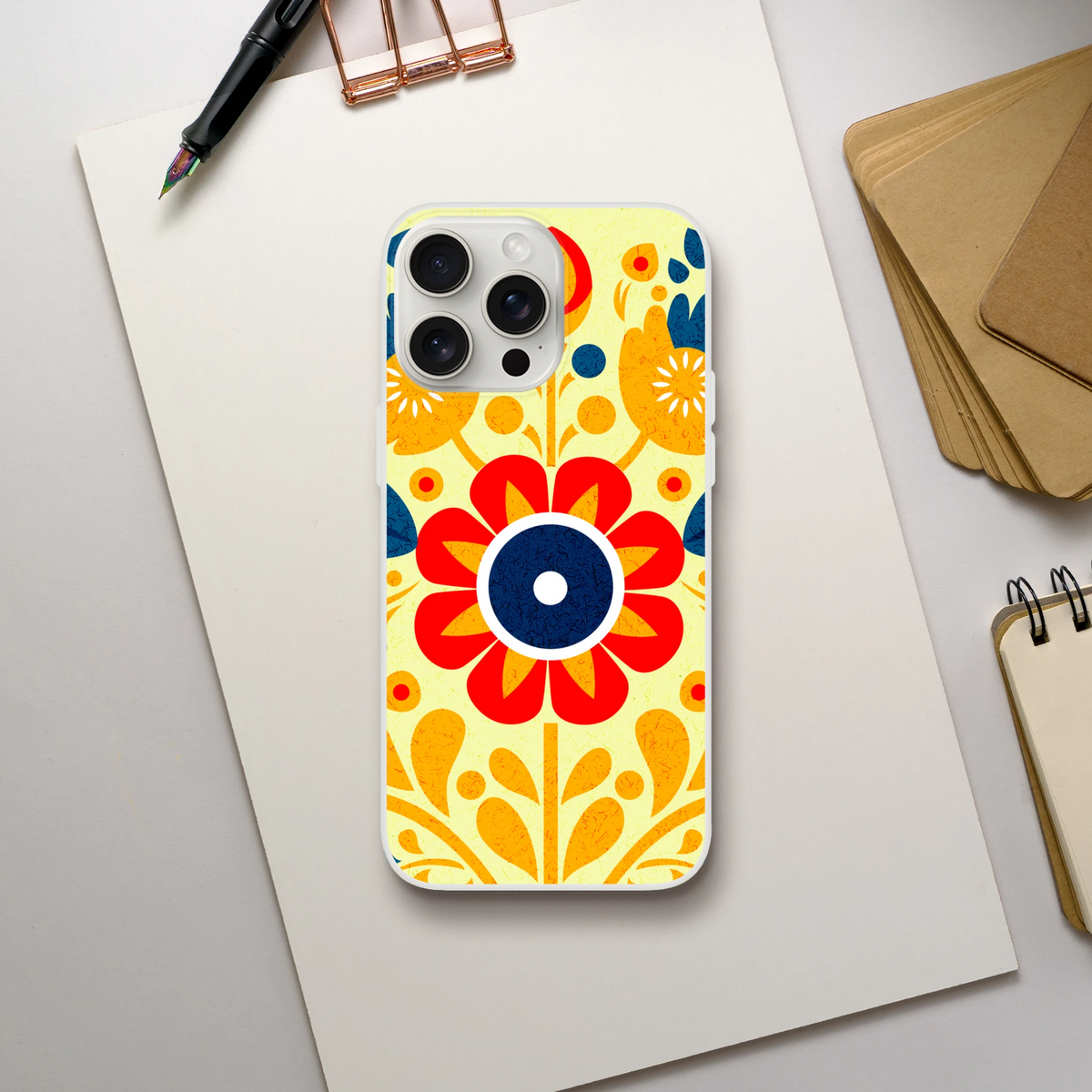 Vintage Floral iPhone Case (13-16) with retro botanical print, yellow-orange floral design, slim matte finish.