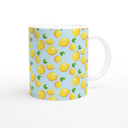 Cute mini lemon-pattern ceramic mug in blue, bright yellow lemons with green leaves on light blue background.