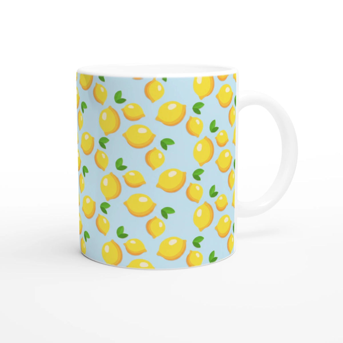Cute mini lemon-pattern ceramic mug in blue, bright yellow lemons with green leaves on light blue background.