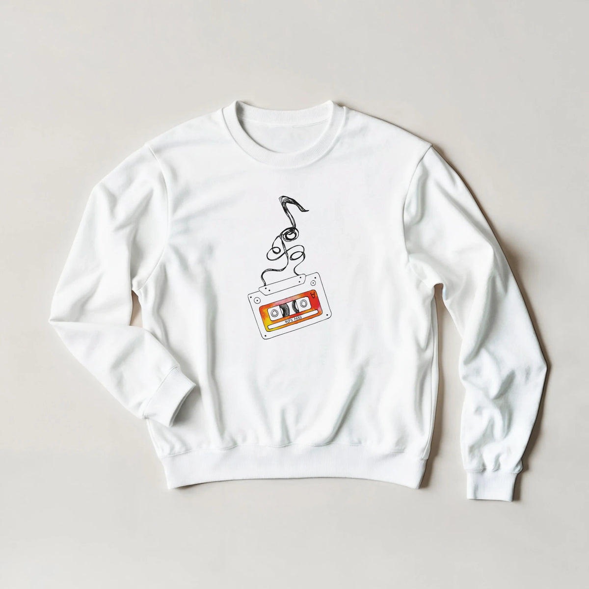 White women's sweatshirt with a retro cassette tape graphic, vintage music illustration.