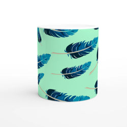 Blue feather-pattern mug on a mint-green gradient, a stylish coffee cup.