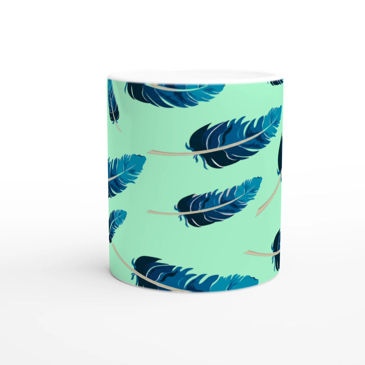 Blue feather-pattern mug on a mint-green gradient, a stylish coffee cup.