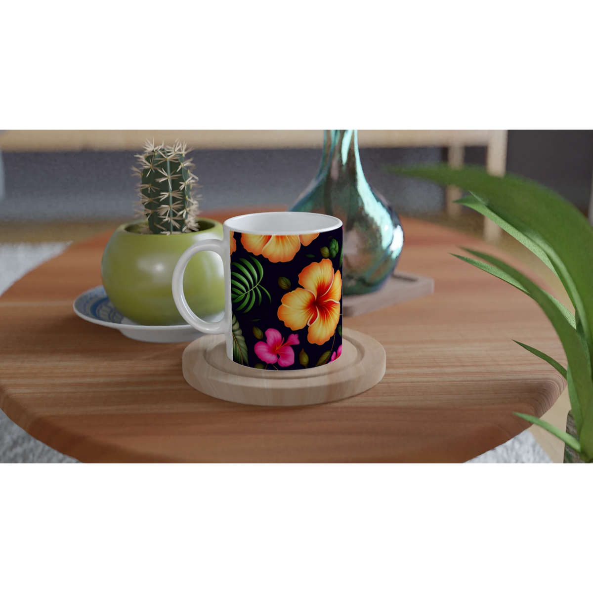 Tropical Hibiscus mug with vibrant floral pattern on a white interior, on a wooden table beside a cactus.