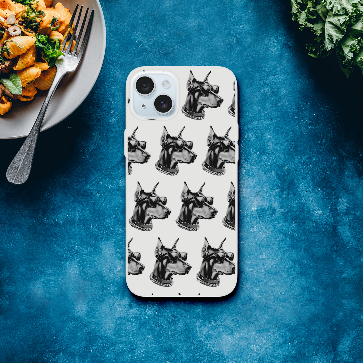 Clear iPhone case for 13-16 with a repeating gangster dog head pattern, featuring sunglasses and chain collars.