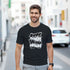 Man wearing black Mental Health graphic T-shirt on a city street; shirt reads "Over thinking solves nothing"