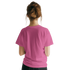 Back view of a woman wearing Cute Wild And Free T-Shirt, retro slogan top by Urban Palm Trees.