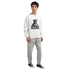 Male model wearing white DJ Club men's graphic sweatshirt with Statue of Liberty DJ print.