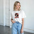 White cotton-blend retro pop-art graphic tee for women featuring a red-haired girl wearing sunglasses.