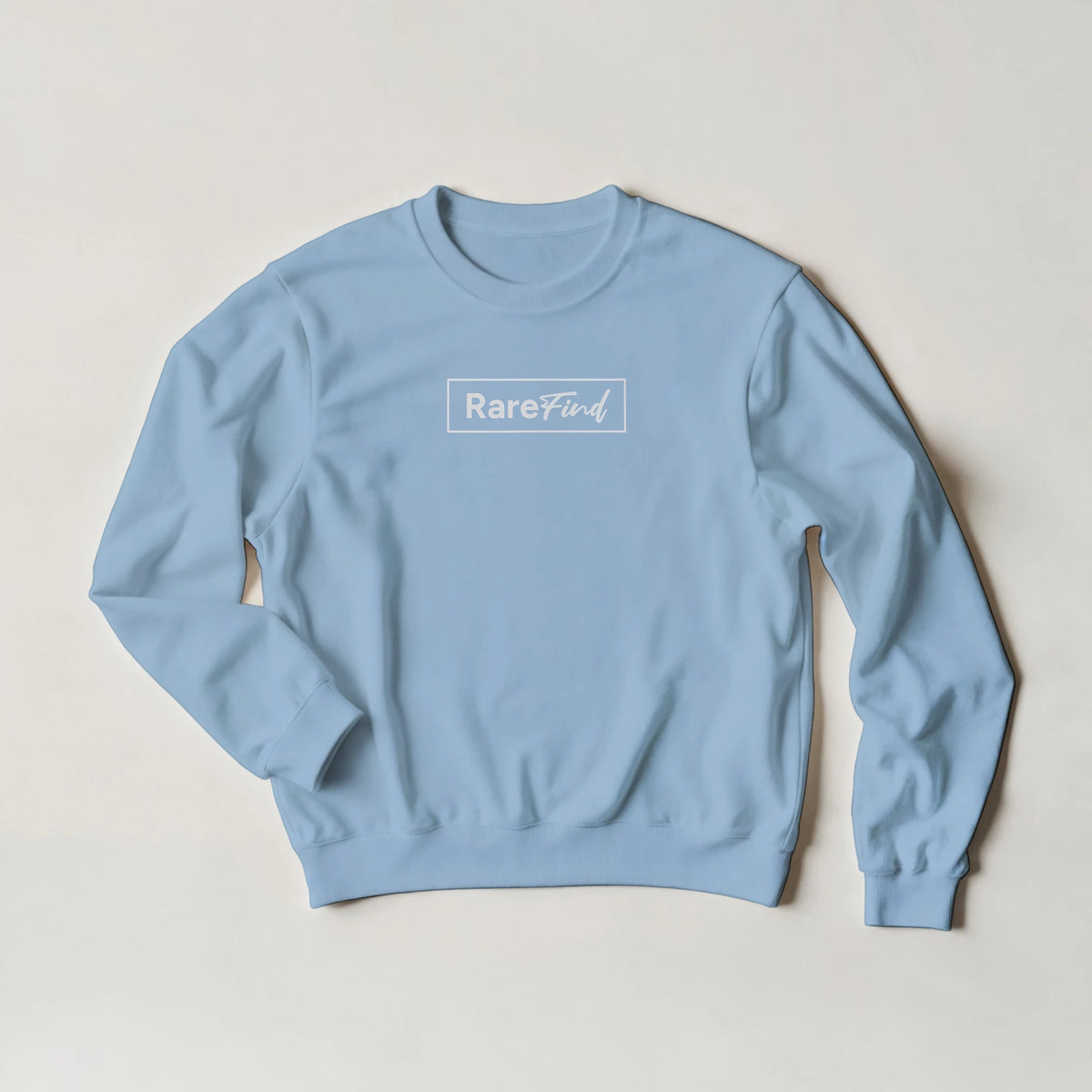 Light blue long-sleeve sweatshirt with white RareFind logo, cozy slogan top for casual streetwear.