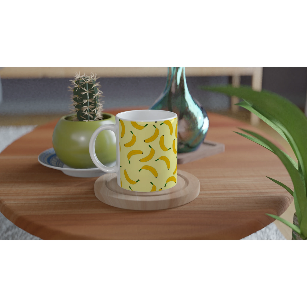 Cute banana-pattern mug with a yellow banana motif on a wooden table beside plants.