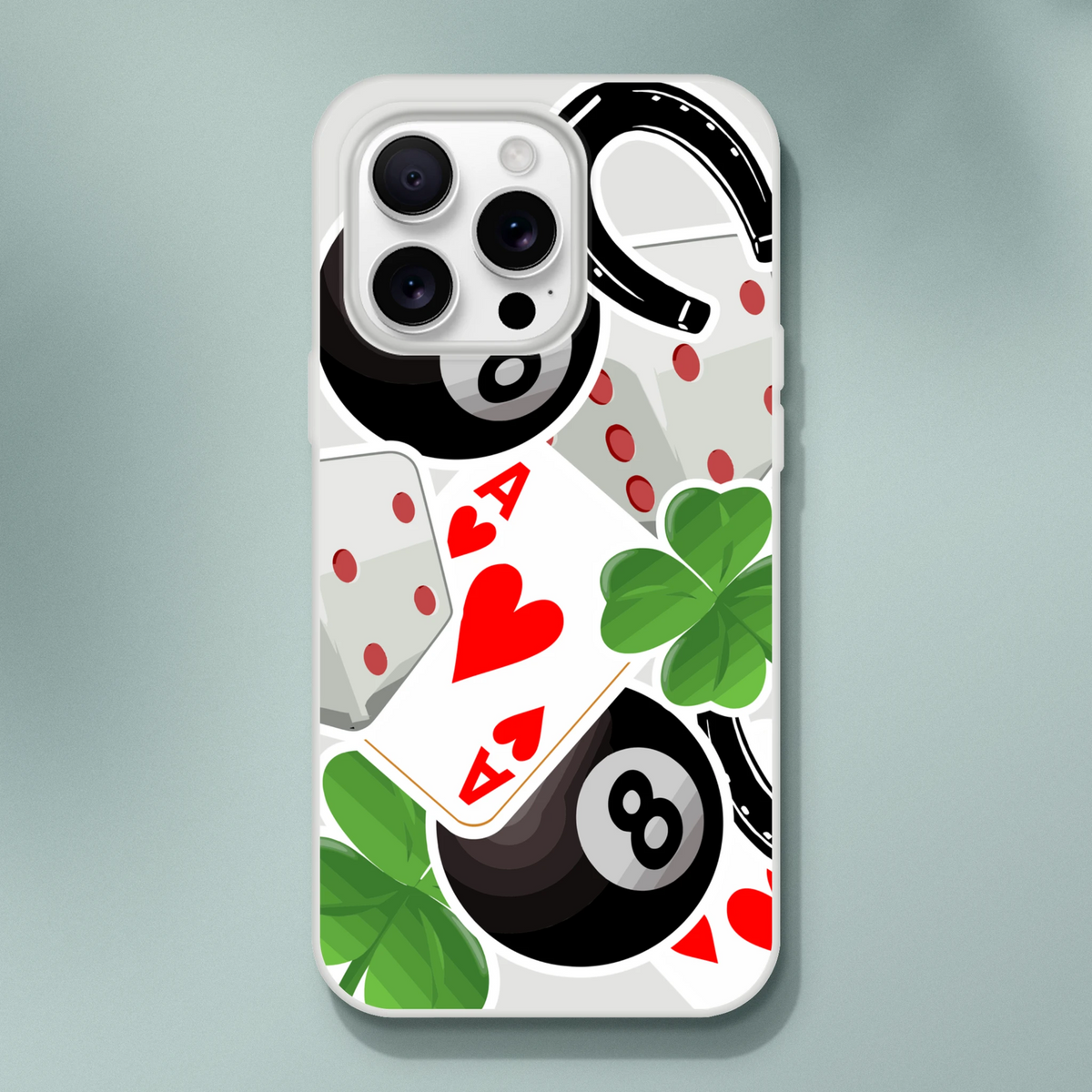 iPhone case featuring lucky charm graphics with an eight ball, ace of hearts, four-leaf clover, and horseshoe design.