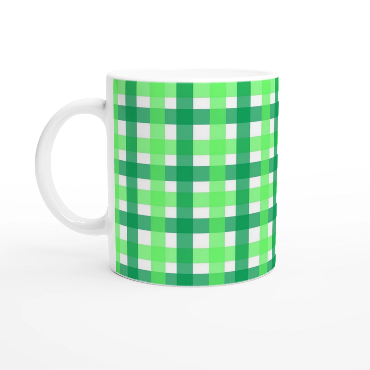 Green gingham ceramic mug with a white handle and checkered pattern.