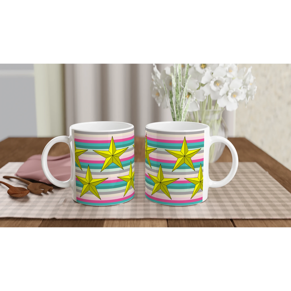 Two pastel stripe mugs with yellow stars and colorful bands on a wooden table.