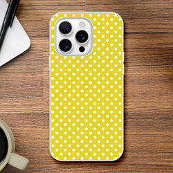 Retro yellow and white polka dot iPhone case with slim TPU保护 for iPhone 13-16 models on wood surface.