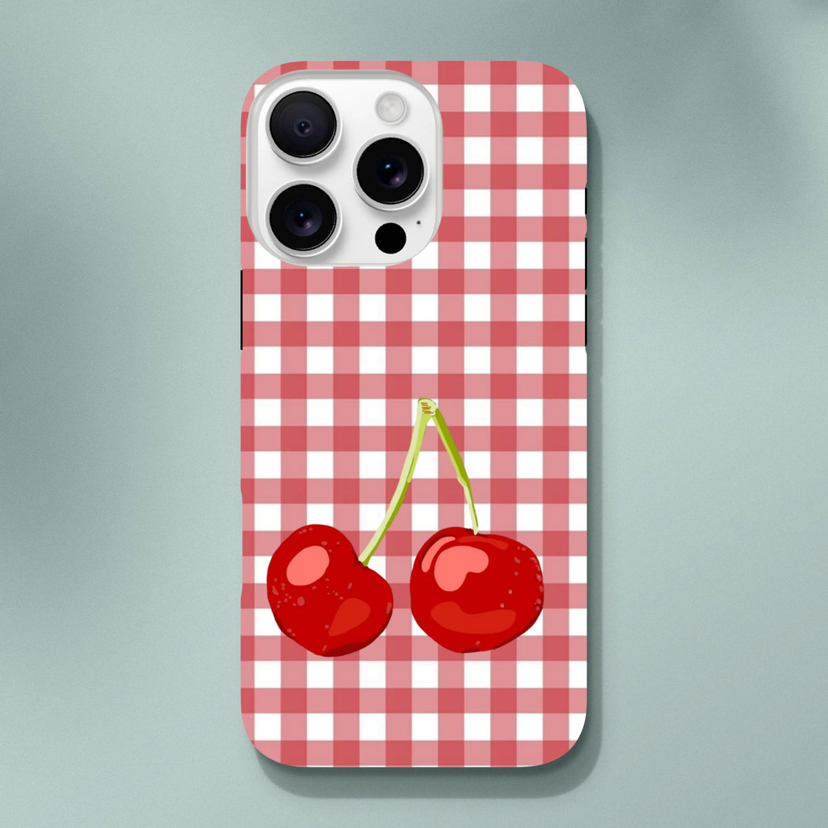 Red and white gingham iPhone case featuring a cute pair of glossy red cherries on green stems.