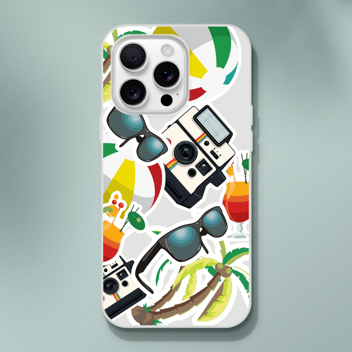 Transparent iPhone case with summer sticker collage design featuring palm trees, vintage cameras, sunglasses, and tropical cocktails.