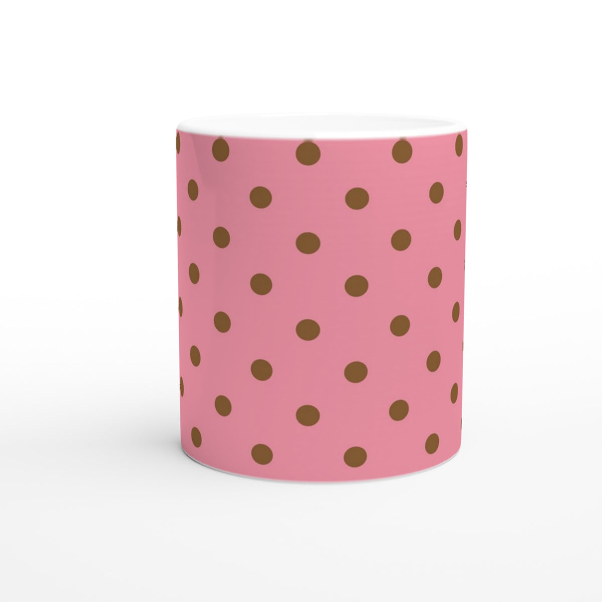 Pink ceramic mug featuring brown polka dots. Retro spotty coffee cup design perfect for daily coffee, tea, or office decor.