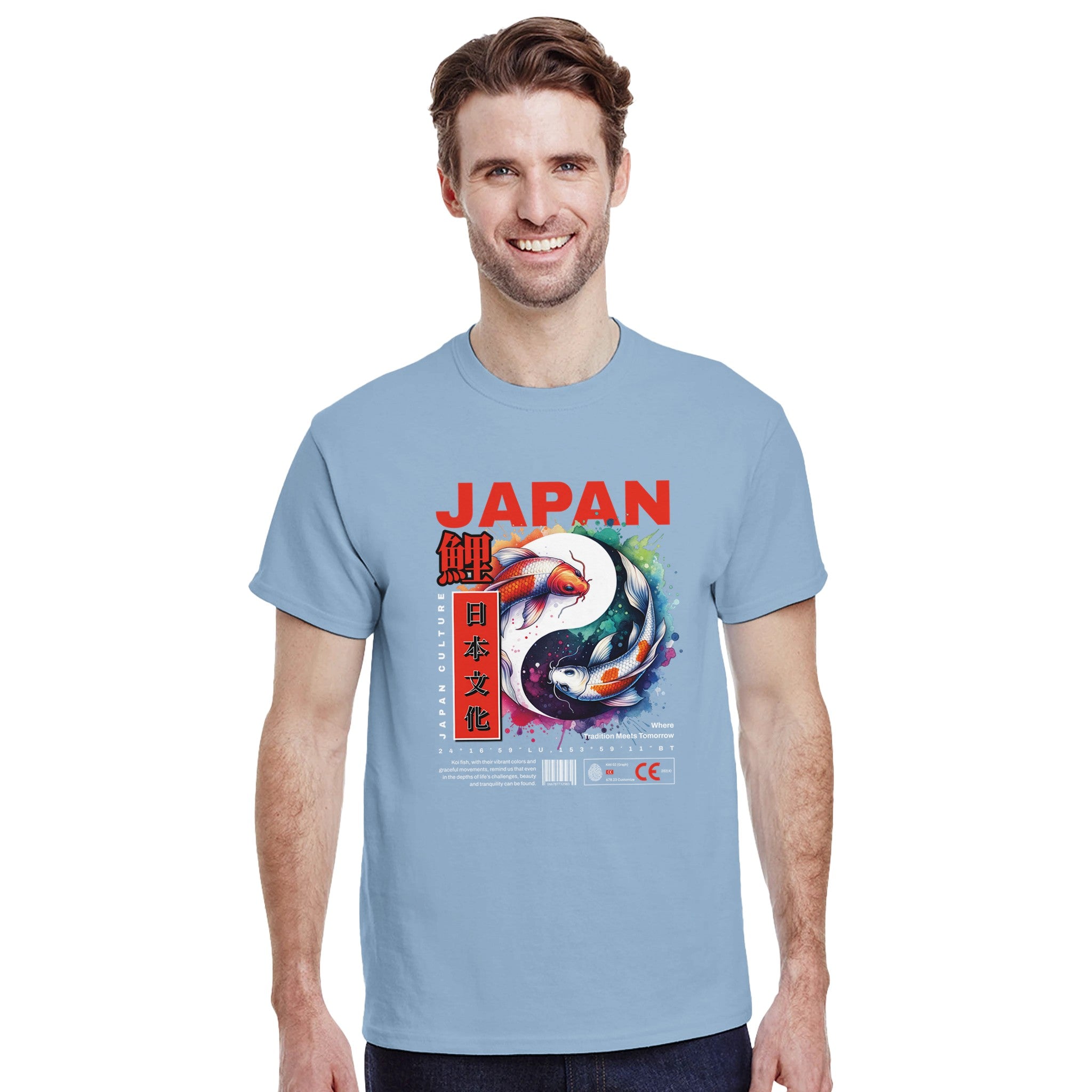 Man wearing a light blue Japanese graphic T-shirt with koi fish artwork and bold JAPAN text.