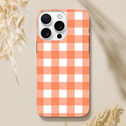Retro orange and white gingham tough iPhone case for models 13-16. Shock-absorbing protective cover with vintage checkered plaid design.