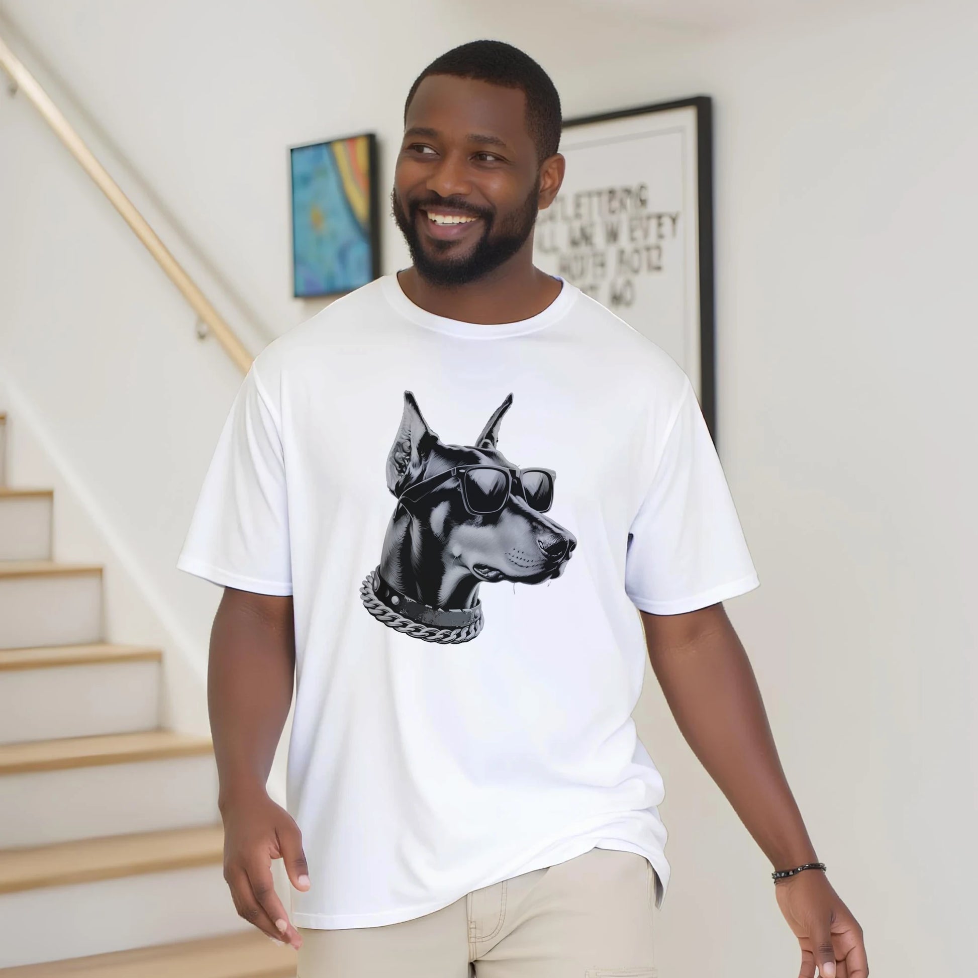 Man wearing a white Gangster Dog graphic tee featuring grayscale dog with sunglasses and chain.
