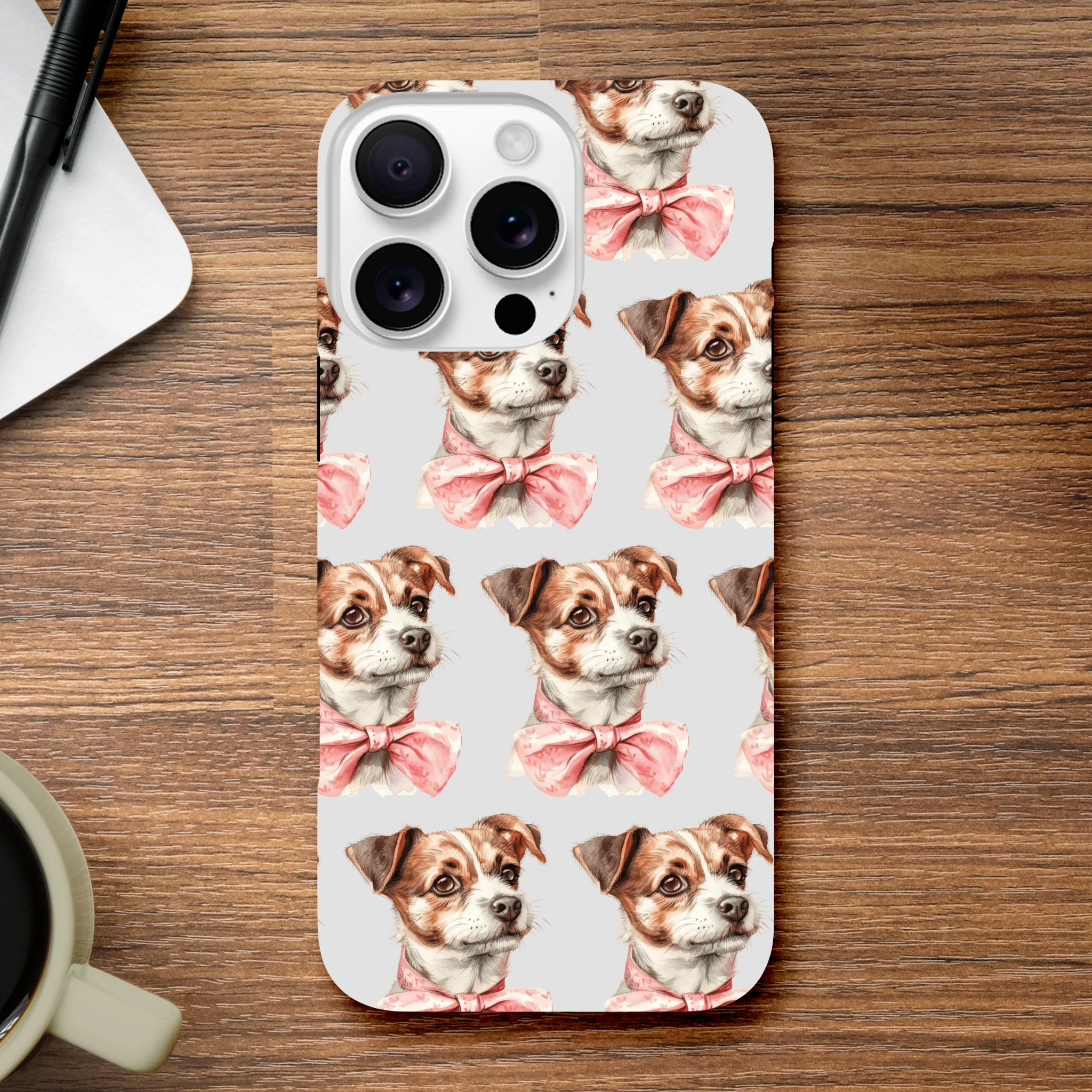 iPhone case with brown dog faces wearing pink bow ties on a light gray background.