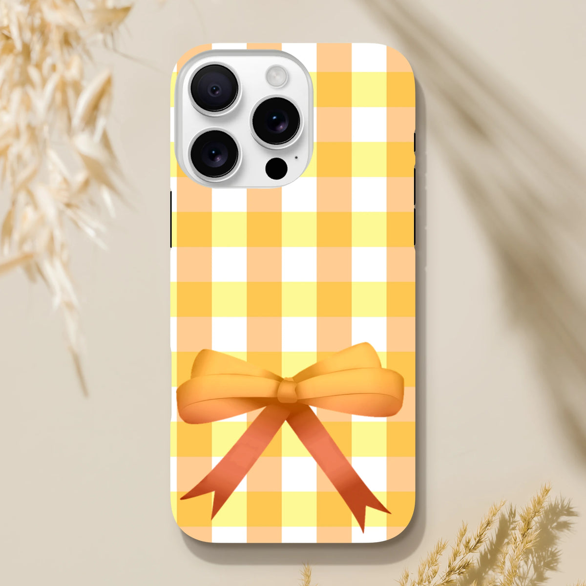 Yellow gingham iPhone case featuring a 3D orange bow, cute coquette street style cover for iPhone 13-16.