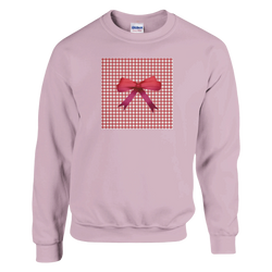 Pink pullover sweatshirt featuring a red gingham square graphic with a realistic red bow, embodying a cute coquette aesthetic.