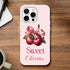 Pink iPhone case with cherry illustration, ribbon, and Sweet Cherries text on a soft pink background.