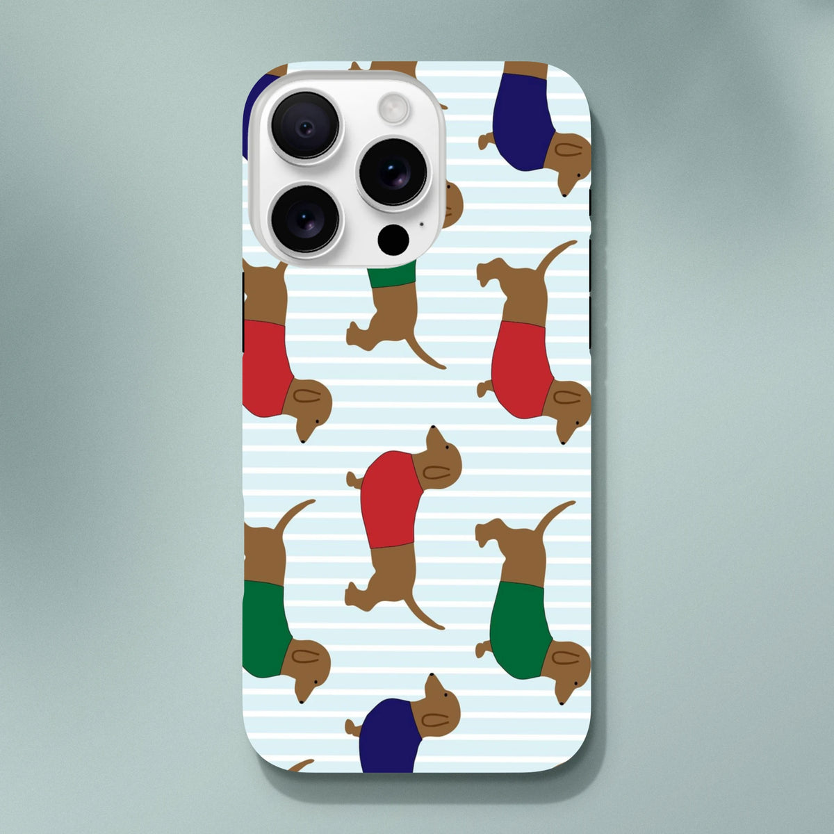Cute Dachshund tough iPhone case featuring sausages dogs in red, green, and blue sweaters on a striped background.