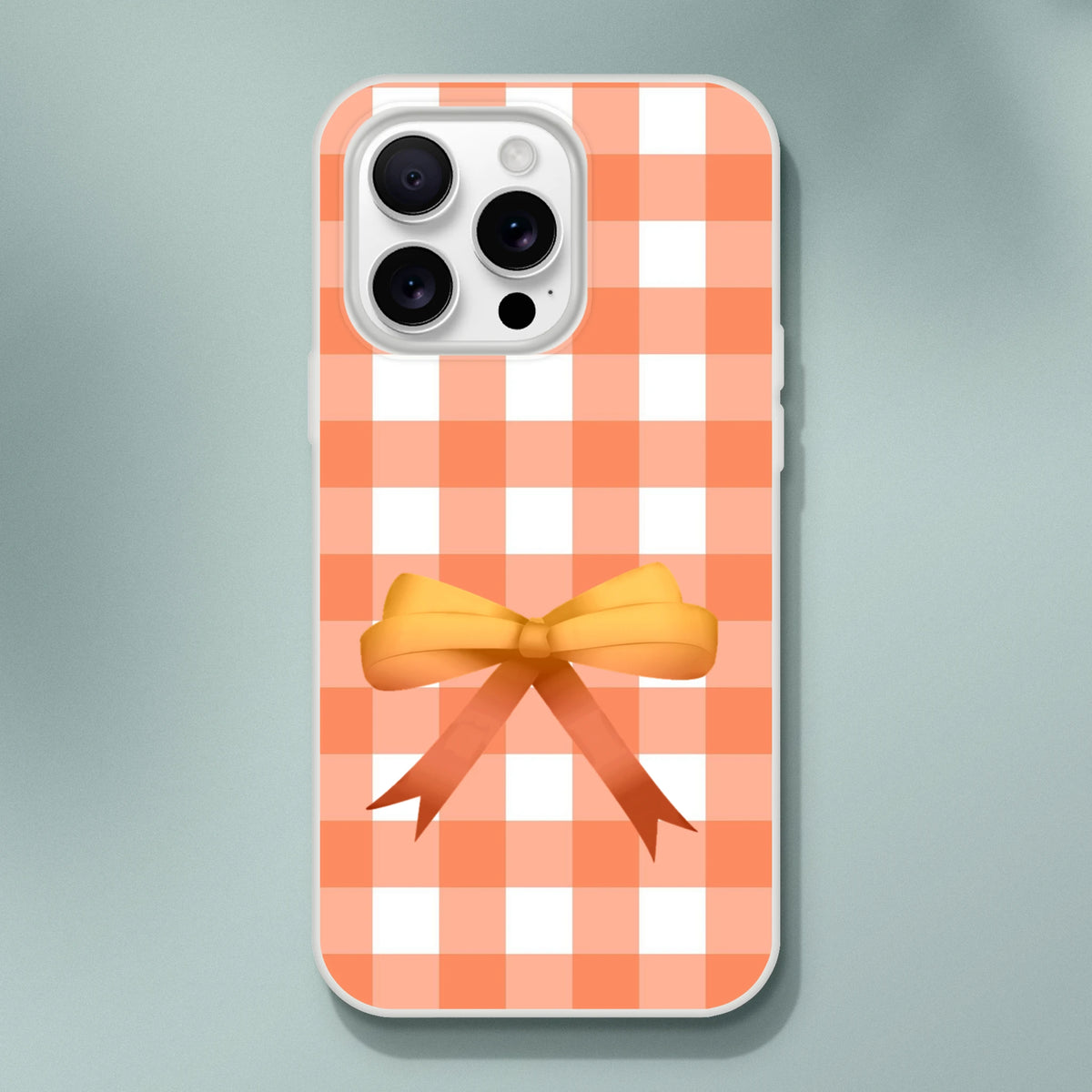 Orange gingham bow iPhone case for 13-16, cute coquette aesthetic.