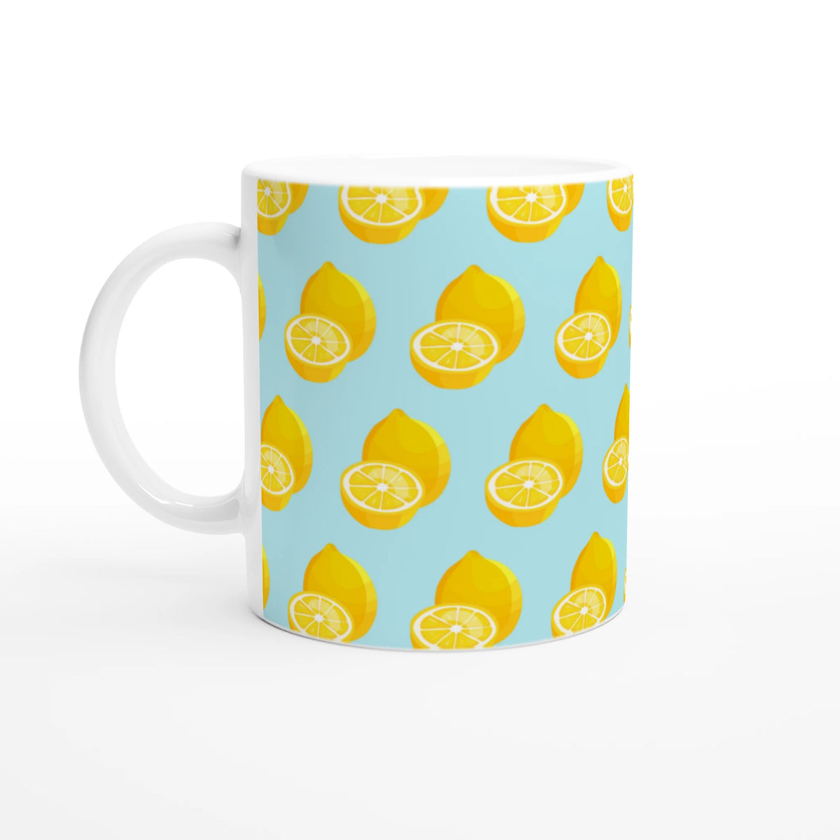 Pastel blue ceramic mug featuring a bright yellow whole and sliced lemon pattern for summer coffee or tea.